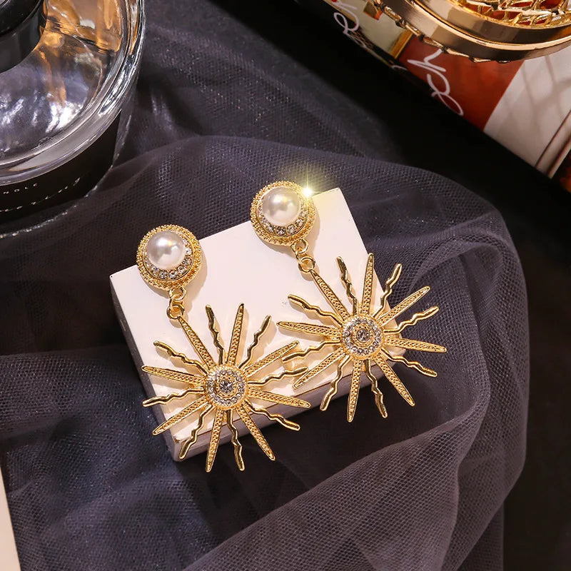 Zonneoorbellen met parel - Mijn Oorbellen